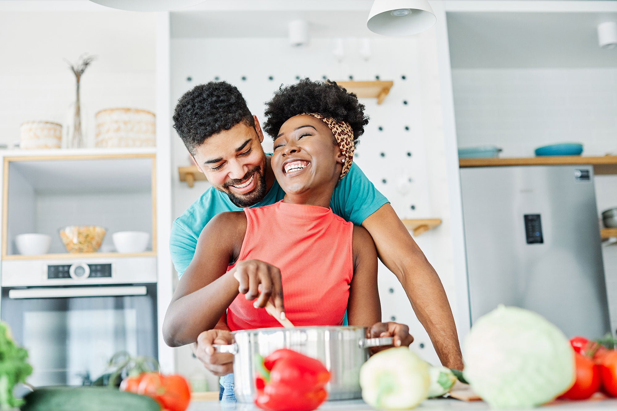 Happy couple cooking together in a modern kitchen